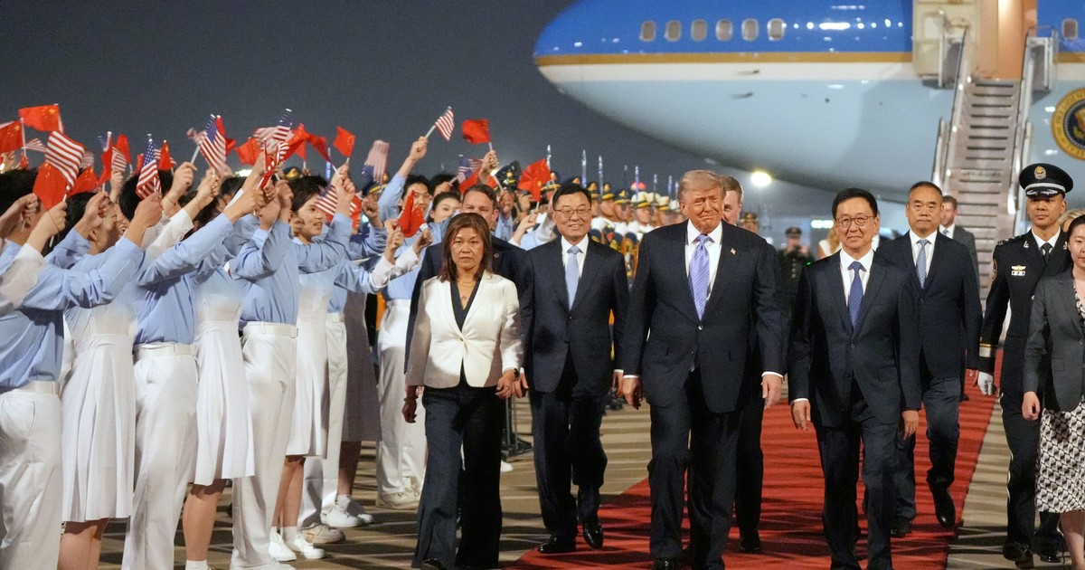 Donald Trump y Xi Jinping estrechándose la mano en Beijing