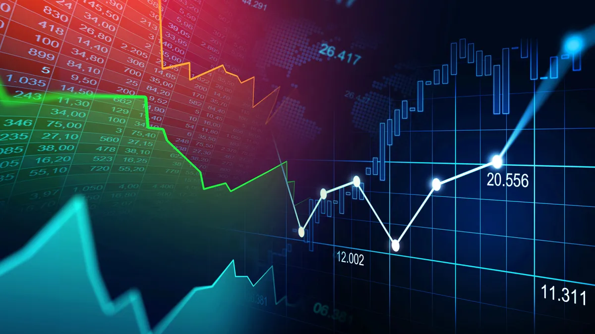 Pantalla de cotizaciones de acciones en Wall Street con números en rojo
