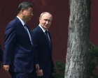 Xi Jinping y Vladimir Putin estrechándose la mano en una reunión previa
