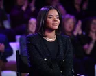 Candace Owens hablando en un micrófono durante un evento