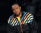 Grizz Chapman sonriendo en una escena de 30 Rock