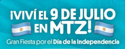 Desfile patrio en González Catán con banderas argentinas y público